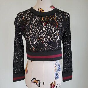 BLACK lace athletic top.  Trimmed in black elastic cuffs and waist red stripe